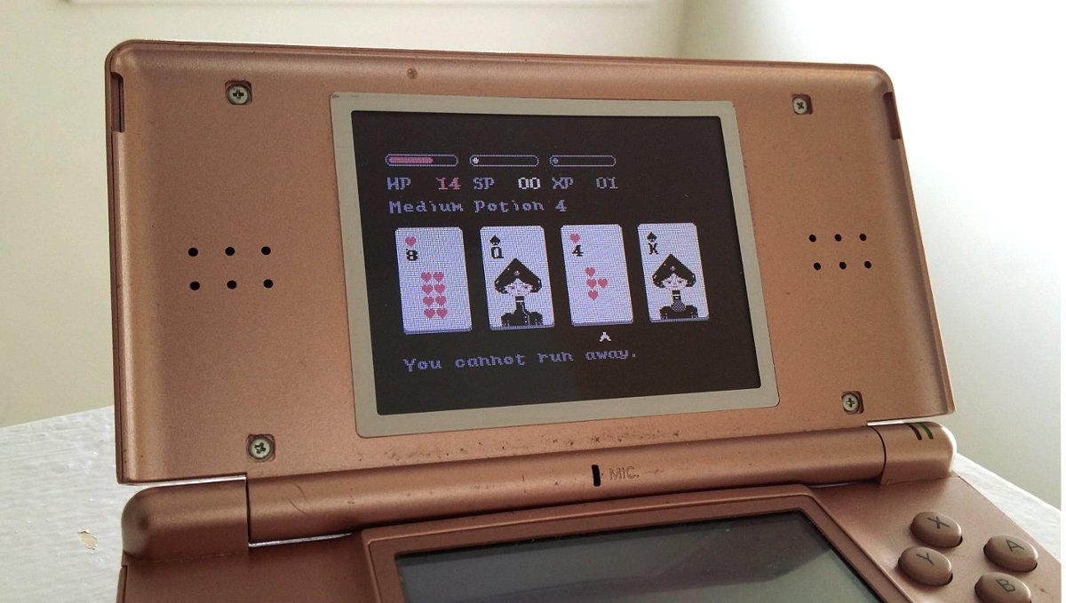 Nintendo DS uxn emulator with Donsol by Deltaf1 A photo of a pink Nintendo DS with the card game Donsol on the screen