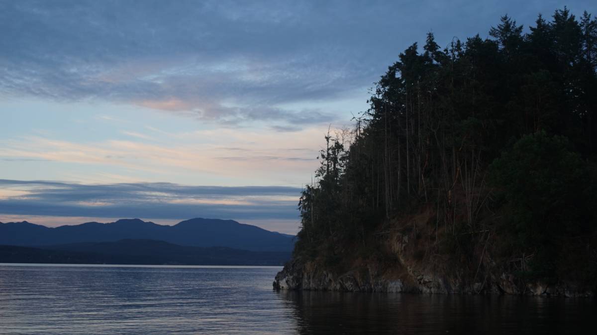 a view of the water, with a giant cliff on the side