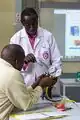 Edward Kamau (standing) taking trainees through a practical training session on safe use of hydrocarbon based refrigerants at the Nairobi Technical Training Institute in Eastleigh, Nairobi.