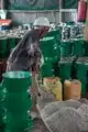 A technician prepares cement mix for portable energy saving jikos at Starose Enterprises in Chuka, Embu county.