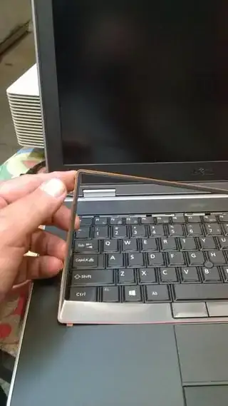 Lifting out the keyboard border ring