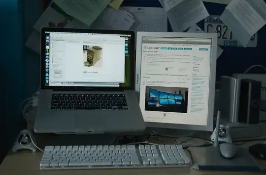 Laptop next to portrait display