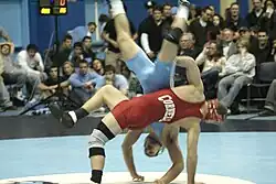 Two students wrestling.