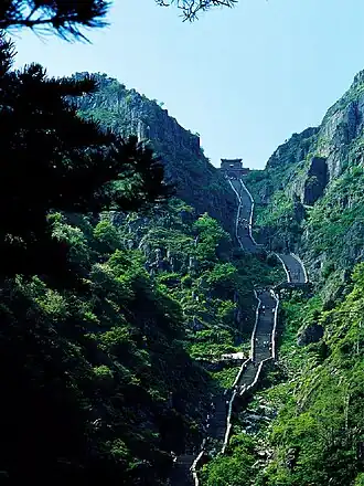 A long stone staircase on the mountain slope