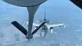 Romanian F-16 of the 53rd Fighter Squadron practice mid-air refueling with a KC-135 of the 117th Air Refueling Wing