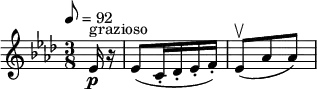 \relative c' { \set Staff.midiInstrument = #"violin" \clef treble \time 3/8 \key aes \major \tempo 8 = 92 \partial 8*1 ees16^"grazioso"\p r | ees8( c16-. des-. ees-. f-.) | ees8(\upbow aes aes)}
