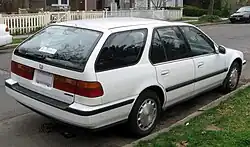 Rear three-quarter view of a five-door car with a two-box body style whose extended rear luggage compartment is incorporated into the passenger cockpit.