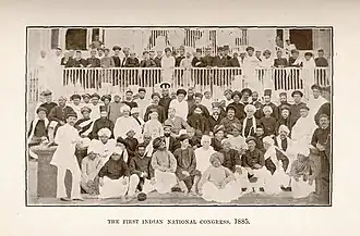 Men in traditional Indian dresses posing for a photograph