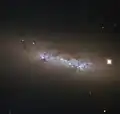 NGC 4248 is located about 24 million light-years away.[24]