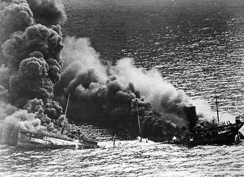 Dixie Arrow breaking in two, with fire engulfing both parts