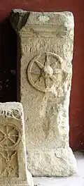 Altar to Jupiter with a relief of a wheel at the Musée de la Romanité.