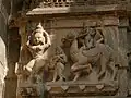 Sculptures of musicians and women at the temple entrance
