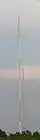 An antenna tower stands 446 feet (136 m) tall in Springfield, MO with its red and white aircraft warning paint visible