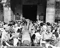 Army nurses climb into trucks leaving Santo Tomas, 12 February 1945