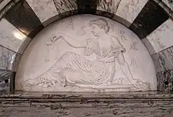 Astraea with her scales (astronomical symbol or )