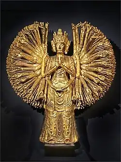 The thousand-armed Quan Âm was carved in the Lê - Nguyễn dynasties, currently on display at the French Guimet Museum