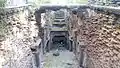 Neglected stepwell filled with debris