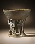 Bowl supported by 3 figures; 850–1500; resist-painted ceramic; height: 28.58 cm (111⁄4 in.), diameter of the bowl: 19.69 cm (73⁄4 in.); from Colombia; Los Angeles County Museum of Art (USA)