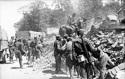 Men clearing debris