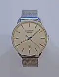 A watch with a fine stainless steel Milanese (dense and tight braided mesh variant) bracelet.[17]