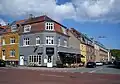 Cafés and housing blocks.