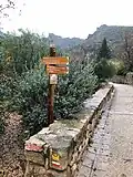 A sign marking the Way of Saint James in Saint Guilhem le Désert