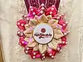 Pink and gold rosette leis for VP Leni