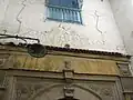 Stylized cypress above the door