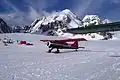 Kahiltna base camp with Radio Control Tower to right behind wing