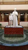 Statue of Don Bosco in the central courtyard