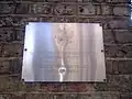 Plaque outside the embassy on Bayswater Road in English and Russian depicting the Coat of arms of Russia