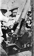Frenchman instructing Serbian in the use of a trench mortar, 1916–1917