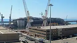Wreck after being lightened and relocated to the Superbacino dock in Genoa, 28 August 2015