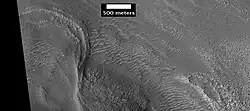 Possible moraine on the end of a past glacier on a mound in Deuteronilus Mensae, as seen by HiRISE, under the HiWish program.