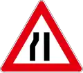 Road narrows on left side