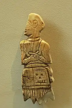 Shell inlay in the name of Akurgal (on the skirt, vertically), found in Girsu. Louvre Museum