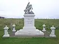 War memorial, including a statue of Saint George, outside the chapel