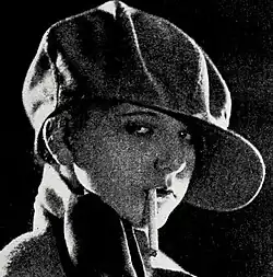 Still image from the 1925 film Lilies of the Streets showing a posed dramatic scene