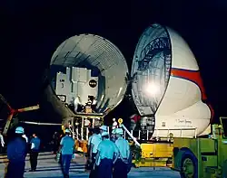 cased LM on airplane in hangar