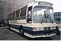 Duple Goldliner IV on Leyland Tiger chassis, with the alternative roof profile incorporating a destination/name display over the windscreen and optional flat glazing.