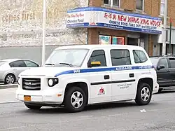 Exterior of an Access-A-Ride cab, with the Access-A-Ride logo
