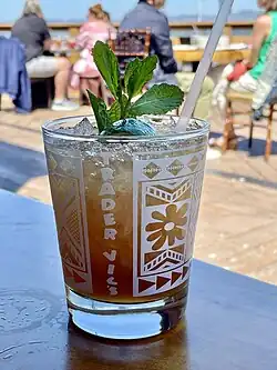 Image 25Mai Tai is a cocktail made of rum, Curaçao liqueur, orgeat syrup, and lime juice. It is one of the characteristic cocktails in Tiki culture. (from List of national drinks)