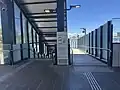 The stairs and ramp leading to Platform 2 from the cocnourse, December 2024