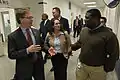 John Walsh (left) and Lisa Posthumus Lyons (middle) speak with JaHaun McKinley (right) of Cascade Engineering.