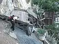 A hiker explores the mine ruins.