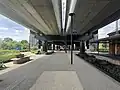 The forecourt, landscaping and seating located south of the concourse, November 2024