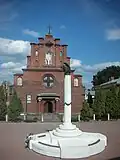 A memorial to the victims of political repressions and the Exaltation of the Holy Cross Church