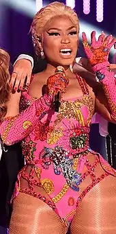 Trinidadian-born rapper Nicki Minaj features on the songs and music videos of Bang Bang, Side to Side and The Light Is Coming