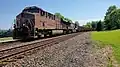 The Pennsylvania Railroad heritage unit, GE ES44AC #8102, leads an empty coal drag on track 1.
