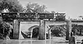 B16 with passenger cars crossed a bridge above Tumpang river beside Warungdowo-Wonorejo main road